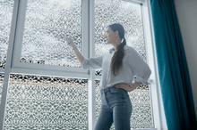 Load image into Gallery viewer, Lifestyle of a young lady in front of Etched Edwardian lace window film