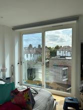 Load image into Gallery viewer, Difference between a clear glass Bifold window and a solar film installed on the clear glass to increase privacy and heat rejection