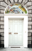 Load image into Gallery viewer, large white door with Kaleidoscopic Semi Circular fanlight glass window film installed on fanlight 