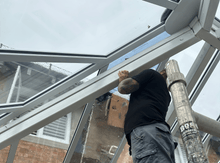 Load image into Gallery viewer, Process of installing solar film on conservatory panels