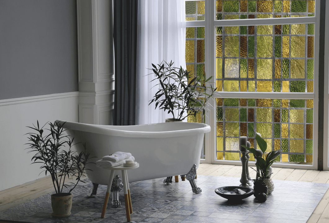 High-end bathroom with a white bath and Green floral stained glass window film on the widows to create beautiful solution to bathroom privacy